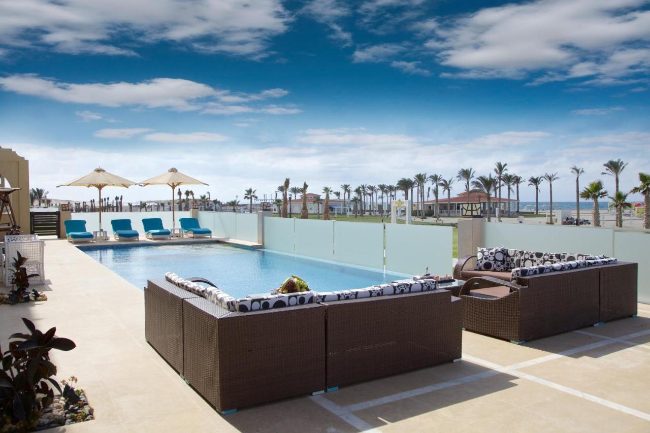 Rixos Alamein - Full Board Plus Ελ Αλαμέιν Εξωτερικό φωτογραφία The pool at the Hilton Sharm El Sheikh